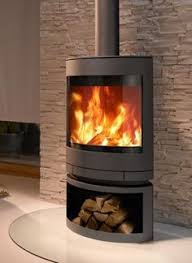 Older wood stoves burn wood inefficiently and must be fed fresh logs on a regular basis to keep a room warm. Modern Scandinavian Wood Stoves Google Search Wide Maybe Curved Wide Angle Contemporary Wood Burning Stoves Modern Wood Burning Stoves Wood Heater