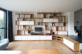 Grande Bibliotheque Meuble Tv En Bois Avec Rangements Fermes Par Des Portes Coulissantes En Ac Bibliotheque Meuble Tv Meuble Rangement Salon Meuble Bas Salon