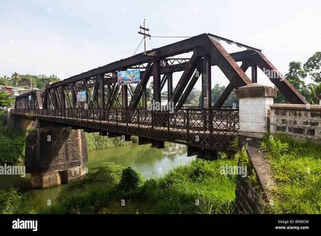Gampola old town 14th century capital Sri Lanka Mahaweli River suspension bridge colonial shopfronts history