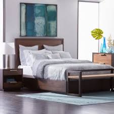 In a guest room or a child's bedroom, a queen bed doubles as a day bed or a lounging sofa. How To Fit Queen Beds In Small Spaces Overstock Com