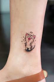 Cute Small Cartoon Cat Tattoo Cartoontattoo Beautifultattoos Cute Cat Tattoo Cat Tattoo Designs Tattoo Trends