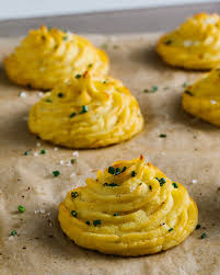 Cheesy Garlic Duchess Potatoes Are The Fancy French Side You Need Recipe Duchess Potatoes Recipes Potatoes