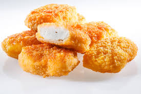 A) a lump of fried chicken in which the entire kfc franchise is based around. Como O Nugget E Produzido Calma Ele Nao E Pintinho Triturado Veja