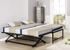 For those who have guests sleep over from time to time but don't have the room to set up an extra bed, a trundle is a space saver. Archer Black Metal Twin Size Platform Daybed With Pop Up Trundle Pilaster Designs