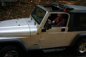 Jeep tj soft top rear window bar brackets tailgate wrangler. How To Open The Sunrider Top On Your Jeep S Soft Top Like A Sun Roof The Jeep Guide