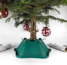 Place a sheet of plastic with a towel on top of it under the christmas tree stand prior to setting it up. Bosmere Christmas Tree Stand For Trees Up To 6 Feet With Up To 4 75 Inch Trunk G470 Green Amazon Co Uk Garden Outdoors