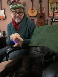 This'll be our first Christmas without our melodramatic kitty, Louie. But  we have our Sally Tomato, the sweetest soul ever. He's a fluffy black rag  doll/ Maine coon mix. For the first