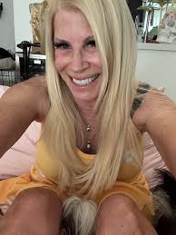 Woman in colorful black dress gets compliments