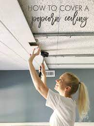 Step by step diy instructions on how to install decorative ceiling tiles. How To Cover A Popcorn Ceiling Using Beautiful Armstrong Woodhaven Planks