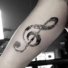 125 Music Tattoo Ideas To Rock Your Body Wild Tattoo Art Facing away from the viewer, like this design, a mermaid tattoo can be an invitation to follow. music tattoo ideas to rock your body