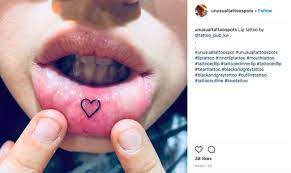 Lip Tattoos All The Bizarre Things People Get Tattooed On Their Inner Lip From Sad Kitties To Dinosaurs