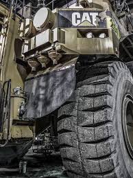 The Caterpillar 795f Is One Of The Largest Mining Trucks In The World Weighing In With An Operating Weight Heavy Equipment Trucks Heavy Construction Equipment
