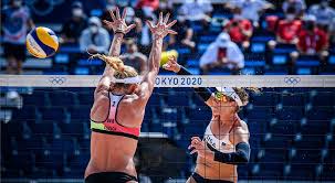 Laura ludwig hugs team mate sara goller of germany after winning a point during the women's beach volleyball preliminary match between brazil and germany on day 4 at horse guards parade on july 31. 21kbudpnfhsncm