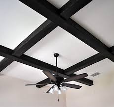 I installed faux wood ceiling beams and put faux shiplap planks over my popcorn ceiling as part of my living room makeover. Urban Woodcrafters Tampa Florida Ceilings