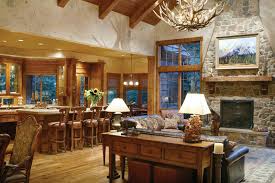 The kitchen features a wrap around bar and is open to the hearth room complete with a fireplace and a door to the grilling porch. Lake House Plan Living Room Photo 01 Cliffwood Trail Lodge Home Plan 011s 0001 House Plans And More