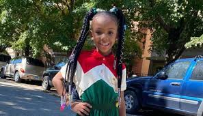 An astronaut in a space suit hangs next to a dangling chandelier made of glass bottles. 3 Year Old Boy Shot Killed After His Own Birthday Party