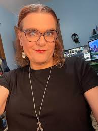 Do trans women still have to pay taxes and can they go topless in public?