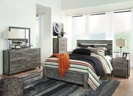 The furniture mall features a large selection of quality living room, bedroom, dining room, home office, and entertainment furniture as well as mattresses, home decor and accessories. The Zelen Warm Gray 5 Pc Queen Panel Bedroom Collection Available At Affordable Furniture Serving Avon Ma