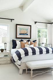 Beach Style Bedroom With White Walls Distressed Furniture And Simple Yet Cute Bedding Set Home Bedroom Coastal Bedrooms Home