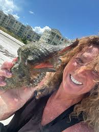 Yes it was returned to the sea. No I didn't take it away with me. The Queen  Conch