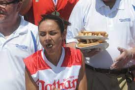 Miki sudo finishes 48.5 hotdogs and buns in 10 minutes at the nathan's famous international hot dog eating contest. 2yk0avd0kfyyym