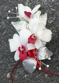 Wrist Corsage Consists Of Orchids Satin Leaves Gems And S Thin Red Ribbon Wrist Corsage Corsage Orchids