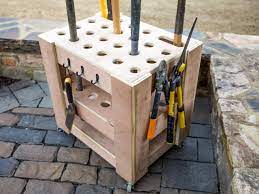 | in this diy garden tool rack, the top front side is sticking out so you can lean the heavier tools through the slots. How To Build A Storage Cart For Yard Tools How Tos Diy