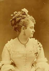 A Beautiful Victorian Lady Wearing A Large Braided Updo 1874 Jewelry Cross Necklace Earrings An Victorian Hairstyles Historical Hairstyles Vintage Hairstyles