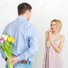Flower earrings as gift jewelry for wife on womens day. Man Gives A Bouquet Of Flowers To Woman Husband Gives A Gift Stock Photo Picture And Royalty Free Image Image 101106844