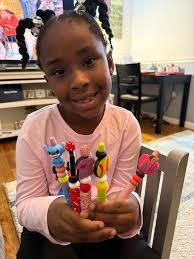 Girl enjoys crafting with her mom