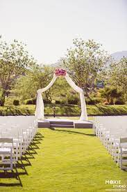 Draping On Arch At Red Rock Country Club In Las Vegas Nv White Polywood Ceremony Chairs Event Las Vegas Wedding Venue Vegas Wedding Venue Red Rock Country