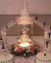 Wedding Cakes With Stairways Wedding Cake With Fountain And Stairs Middle Weddi Wedding Cakes With Flowers Fountain Wedding Cakes Wedding Cakes With Cupcakes