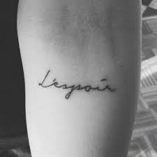 40 Minimalist One Word Tattoo Ideas That Are Beautiful On Every Woman French Word Tattoos French Tattoo Tattoo Quotes