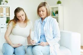 pregnant-woman-talking-to-her-doctor-in-a-room_1098-2034-copy-2 ...
