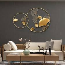 Beautiful young couple hanging picture on wall together while moving into new home. New Chinese Wall Wrought Iron Ginkgo Biloba Home Decoration Crafts Creative Wall Hanging Sofa Background Mural Or Home Decor Wall Art Creative Walls Home Decor