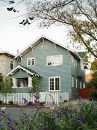Here are the 10 exterior gray paints that they most often turn to An Open And Family Friendly Home Makeover Better Homes Gardens Bhg Com Green House Exterior House Exterior Cottage Exterior