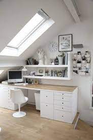 A small attic home office with wooden beams on the ceiling, an airy trestle desk, a white chair, a creative rug, a metal basket and a sofa in the corner. Wall Storage Keeps The Desk Http Desklayoutideas Blogspot Com Home Office Design Tiny Office Home