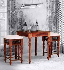 The round pub table features an oak wood grain veneer with nailheads along the apron. Buy Stafford Solid Wood Bar Table Set In Honey Oak Finish Amberville By Pepperfry Online Bar Table Sets Bar Furniture Furniture Pepperfry Product