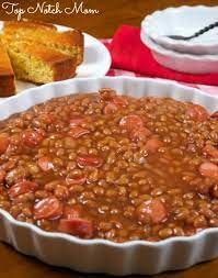 Chili powder, tomato sauce, and mustard make a flavorful sauce for the beans and vegetables. Baked Beans Hot Dogs