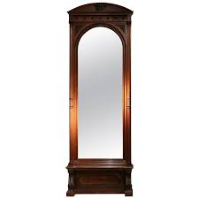 Well you're in luck, because here they come. 19th Century English Greek Revival Hand Carved Wood Full Length Floor Mirror For Sale At 1stdibs