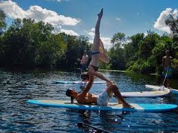 Stand Up Paddle Board Yoga Couples Yoga Sup Yoga Partner Yoga On A Paddle Board Yoga Surf Pool Standup Paddle