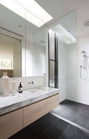 For a bathroom with a seamless and contemporary feel, consider opting for minimalist grey tiles on both the floor and the walls. Bathrooms Gray Tile Bathroom Floor Grey Bathroom Floor Bathroom Tile Diy