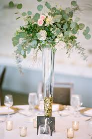 Put your centerpieces on display with pedestal vases. Oh Colorado You Look So Glamorous In This Glittering Garden Wedding Tall Wedding Centerpieces Flower Centerpieces Wedding Flower Centerpieces