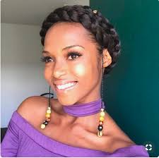It's hard not to be swept up in bohemian mania. Beautiful Black Woman In A Purple Shirt With A Halo Braid Douglas J