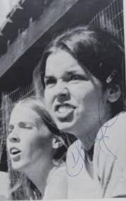 What is Cheryl saying in the 1974 photo?