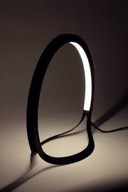 two simple led lights bent and overlapping each other characterized by the organic lines flowing from the sh lighting design lighting inspiration lamp design