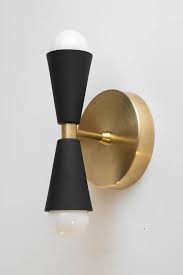 Give any room a welcoming glow with our candle sconces. Black Gold Sconce Mid Century Wall Sconce Cone Wall Light Etsy Gold Wall Lights Wall Lights Brass Wall Light