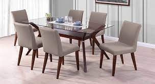 Gate legged dining tables have been around for a long time now, and they still provide a good answer for small homes that lack an area in which to set up a long table permanently. Wesley Persica Leatherette 6 Seater Glass Top Dining Table Set Urban Ladder