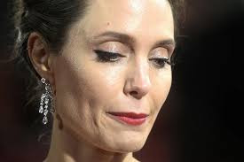 Angelina Jolie says Brad Pitt banned her from living overseas