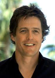 British actor Hugh Grant poses for photographers during a photocall in Cannes May 25, 2002 - 250162-british-actor-hugh-grant-poses-for-photographers-during-a-photocall-in